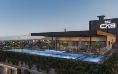 Rooftop ao entardecer com piscina iluminada e logotipo CX8 aceso, ângulo panorâmico menor — Infinite Campeche em Campeche, Florianópolis