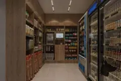 Fachada frontal do edifício com palmeiras na entrada, logotipo Infinite Smart Living e número 2514 — Infinite Campeche em Campeche, Florianópolis