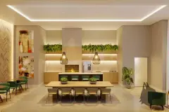Salão gourmet com mesa de jantar longa, churrasqueira, jardim vertical suspenso e luminárias pendentes — Jardim Cacupé Residence em Cacupé, Florianópolis