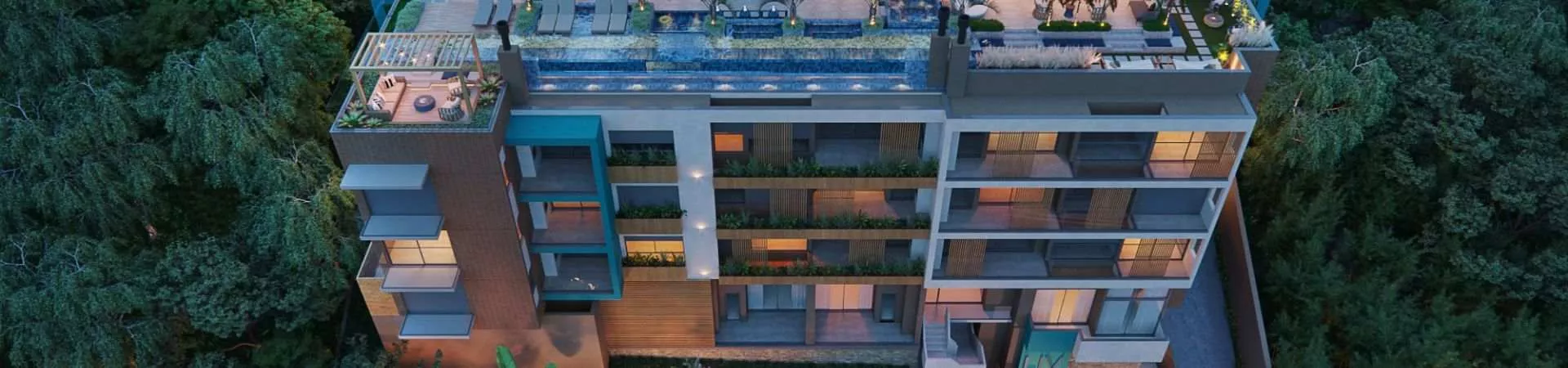 Perspectiva aérea do Liv 2460 Boutique Residence ao entardecer com rooftop, piscina e vegetação nativa de João Paulo — LIV 2460 Boutique Residence em João Paulo, Florianópolis