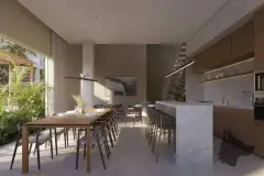 Perspectiva ilustrativa da sala de jantar integrada à cozinha com ilha de granito, cooktop, adega e escada para o mezanino — Lumina Residence em Cachoeira do Bom Jesus, Florianópolis