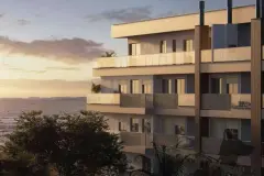 Perspectiva ilustrativa da fachada lateral do edifício ao pôr do sol com varandas e vista para o mar, ângulo alternativo — Lumina Residence em Cachoeira do Bom Jesus, Florianópolis
