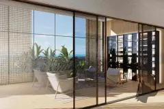 Perspectiva da área de relaxamento do spa do Maldivas Spa Urbano com poltronas, jardim e vista para o mar — Maldivas SPA Urbano em Ingleses, Florianópolis