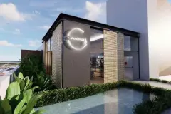 Perspectiva da fachada do edifício do Maldivas Spa Urbano com logotipo iluminado e jardim — Maldivas SPA Urbano em Ingleses, Florianópolis