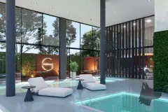 Perspectiva do hall do Maldivas Spa Urbano com sofás, recepção iluminada e logotipo em halo — Maldivas SPA Urbano em Ingleses, Florianópolis