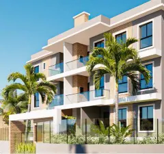 Fachada lateral do edifício com sacadas envidraçadas, palmeiras e revestimento de tijolo aparente — Manhattan Residence em Ingleses, Florianópolis