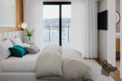 Suíte com cama de casal, cabeceira estofada branca, janela ampla e TV na parede — Mar do Norte Studios em Ingleses, Florianópolis