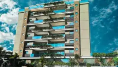Fachada do edifício com balcões amplos envidraçados e jardins verticais, revestimento misto — Mar dos Corais em Coqueiros, Florianópolis