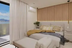 Sala de estar com sofá cinza, painel em mármore com TV embutida e varanda com vista para a Baía Norte — Maranello Residence em Balneário, Florianópolis