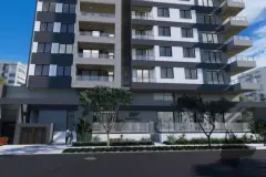 Fachada lateral ampla do edifício com sacadas e marquise no térreo — Maranello Residence em Balneário, Florianópolis
