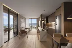 Sala de estar e cozinha integradas com ilha em mármore, armários em madeira escura, sofá e varanda com vista para o mar — Marena em Canasvieiras, Florianópolis