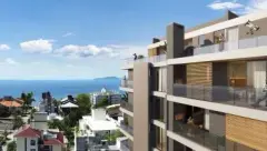 Fachada lateral do edifício com balcões de madeira e vista para o mar — Marena em Canasvieiras, Florianópolis