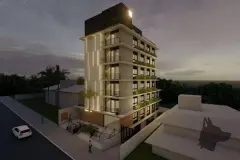 Fachada noturna iluminada do edifício com 8 andares e logotipo MaxStudios no topo — Max Studios 45 em João Paulo, Florianópolis