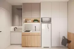 Cozinha compacta com armários em dois tons, geladeira integrada e nicho iluminado com ervas — Max Studios 45 em João Paulo, Florianópolis