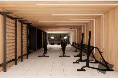 Lounge integrado à academia com sofá curvo branco, poltronas e sala de fitness visível pelo vidro — Max Studios 45 em João Paulo, Florianópolis
