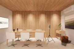 Área comum com poltronas brancas, máquinas de lavar à esquerda e sala de reunião ao fundo — Max Studios 45 em João Paulo, Florianópolis