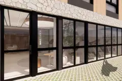 Entrada frontal diurna MaxStudios 45 com palmeira, lixeiras e bicicleta na calçada — Max Studios 45 em João Paulo, Florianópolis