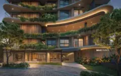 Fachada noturna do edifício com varandas curvas cobertas de vegetação e entrada MaxStudios iluminada — Max Studios 177 em Pantanal, Florianópolis