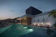 Piscina do rooftop à noite com espreguiçadeiras, guarda-sóis listrados e logotipo MaxStudios iluminado — Max Studios 177 em Pantanal, Florianópolis