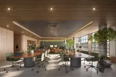 Coworking com mesas ovais, cadeiras, computadores, árvores internas e vista panorâmica para morros — Max Studios 177 em Pantanal, Florianópolis