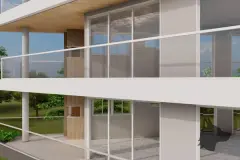 Detalhe das varandas com vidro transparente e churrasqueira de tijolo com área verde ao fundo — Maxxi IU em Jurerê, Florianópolis