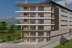 Fachada lateral oblíqua com 6 andares, varandas, revestimento em dois tons e estacionamento — Maxxi IU em Jurerê, Florianópolis