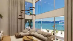 Sala de estar duplex com sofá bege curvo, lustre de anéis e janela panorâmica com vista para o mar — Maxxi View em Jurerê, Florianópolis