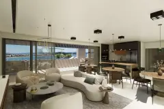 Sala de estar com sofá bege curvo, cozinha integrada e varanda com vista para o mar — Maxxi View em Jurerê, Florianópolis