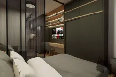 Suíte com cama de casal, armário escuro embutido, escritório integrado com TV e prateleiras iluminadas — Maxxi View em Jurerê, Florianópolis