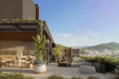 Terraço privativo com mesa de jantar redonda, sofá, vasos e vista para os morros e cidade — Meraki Allure em Jurerê, Florianópolis
