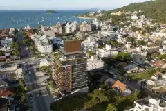 Vista aérea do empreendimento Meraki Allure em Jurerê, Florianópolis, com praia e mar ao fundo — Meraki Allure em Jurerê, Florianópolis