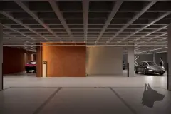 Garagem premium com Porsche estacionado, parede de corten e iluminação linear — Meraki Allure em Jurerê, Florianópolis