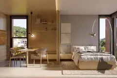 Studio integrado com cama de casal, mesa de jantar, prateleiras e vista para os morros ao entardecer — Meraki Allure em Jurerê, Florianópolis