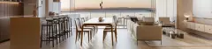 Sala de jantar e estar open plan com mesa de madeira, sofá bege e vista panorâmica para o pôr do sol sobre o mar — Meraki Sunset em João Paulo, Florianópolis