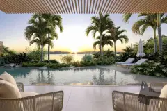 Piscina com deck e poltronas sob pérgola ripada, palmeiras e jardim com vista para o mar ao entardecer — Meraki Sunset em João Paulo, Florianópolis