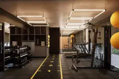 Academia com halteres, aparelhos de musculação, esteiras e trilha amarela no piso com letreiro Multigym — Mirá Apartments em Centro, Florianópolis