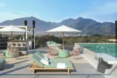Piscina no rooftop com espreguiçadeiras, poltronas e panorama dos morros do Campeche — Mobby Campeche en Campeche, Florianópolis