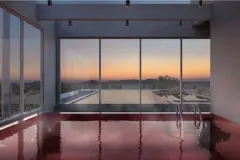 piscina aquecida interna ladrilhos vermelhos janelas panorâmicas vista rooftop morros entardecer — Natus em Ponta das Canas, Florianópolis