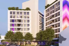 fachada térreo entrada comercial lojas elemento gráfico chevrons portaria logo torres ao fundo — Next Trindade em Trindade, Florianópolis