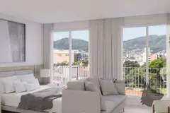 suíte cama casal sofá curvo cinza janela ampla vista cidade colinas cortinas — Next Trindade em Trindade, Florianópolis
