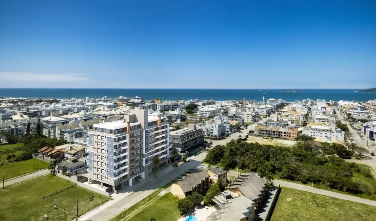 vista aérea drone edifício bairro Ingleses mar azul ao fundo — Oceanic Residence em Ingleses, Florianópolis