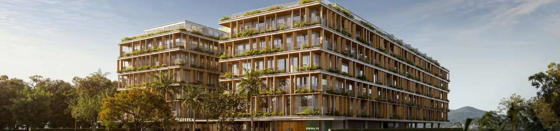 fachada render 2 blocos 6 andares ripas madeira varandas vegetação jardim lojas térreo café Óppera palmeiras árvores — Óppera Smart Life em Campeche, Florianópolis