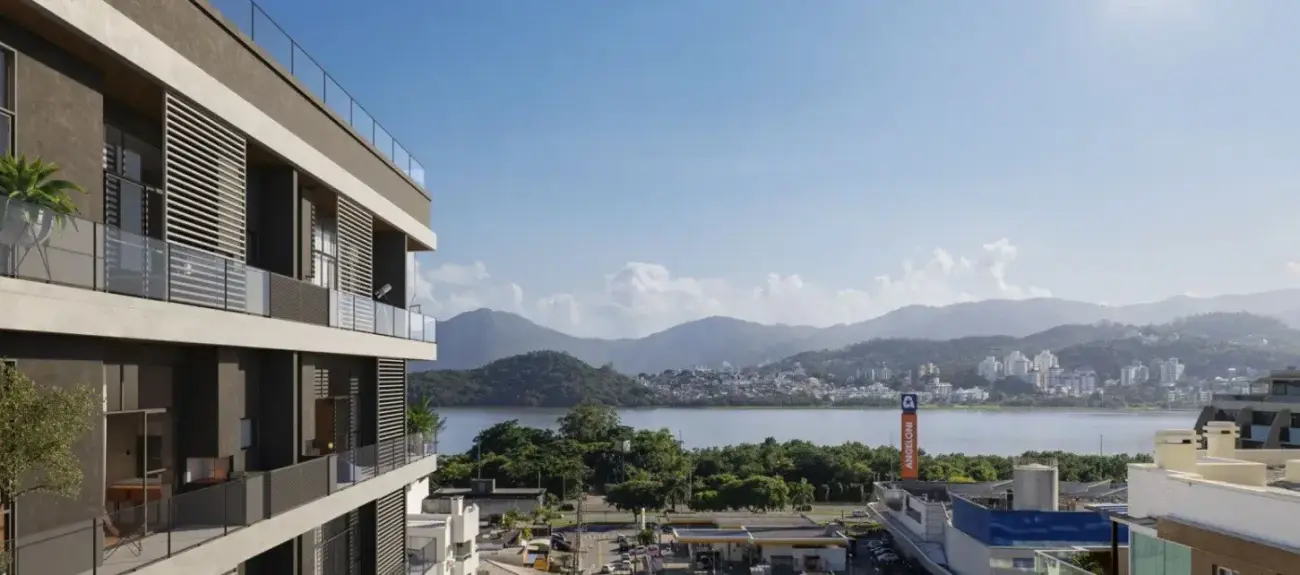 fachada render lateral varandas vidro venezianas brancas bairro Agronômica lagoa montanhas fundo supermercado Angeloni — Opus em Agronômica, Florianópolis