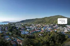vista aérea drone bairro Cachoeira do Bom Jesus praia mar montanhas logo Opus One — Opus One em Cachoeira do Bom Jesus, Florianópolis