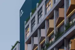 fachada render detalhe lateral varandas plantas amarelas painel teal logo Parkside iluminado noturno — Parkside Itacorubi em Itacorubi, Florianópolis