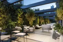 render terraço jardim área convivência jardim vertical parede verde pérgola metal mesas cadeiras poltronas sofás entardecer — Physis Place em Centro, Florianópolis