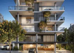 render fachada lateral edifício 10 andares varandas plantas ipê amarelo carros noturno iluminado — Physis Place em Centro, Florianópolis