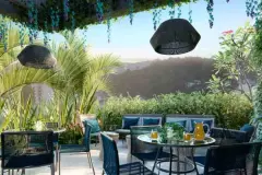 render terraço coberto área convivência mesa redonda cadeiras azuis pendentes vime plantas vista morros entardecer — Playa Negra Residence em Agronômica, Florianópolis