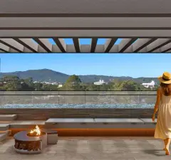 Perspectiva do rooftop com área de descanso, fogão de lenha e vista panorâmica para a cidade — Puerto Canas em Canasvieiras, Florianópolis