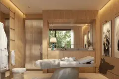 Perspectiva da sala de spa com maca de tratamento, armários ripados em madeira e espelho iluminado — Puerto Madero em Jurerê, Florianópolis